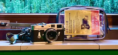 Hand check film in China - trains and airports.